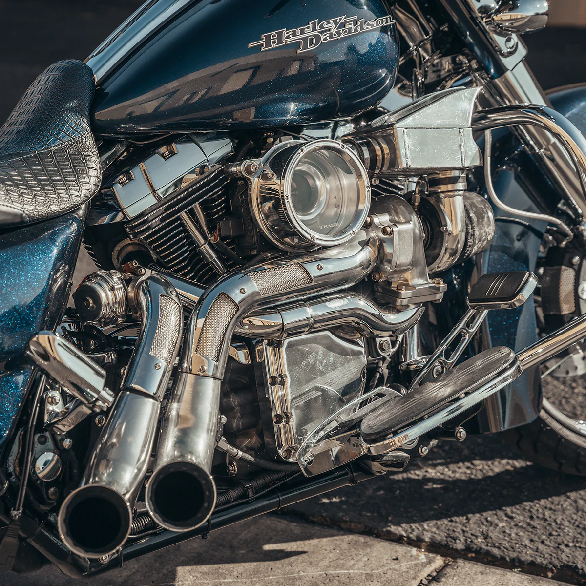 Close Up shop of Harley Davidson touring model with a chrome Trask touring typhoon turbo kit installed