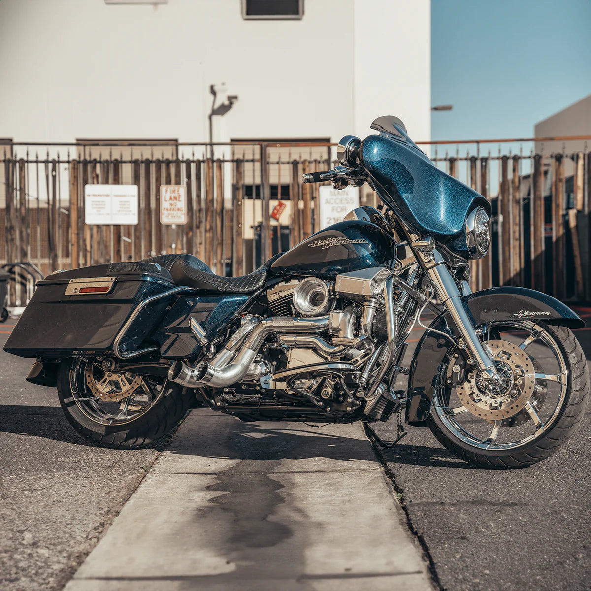 wide angle shot of a Harley Davidson touring model with a chrome Trask touring typhoon turbo kit installed