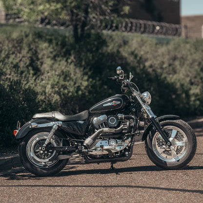 Wide angle shot of a Harley Davidson sportster with a black on black Trask sportster turbo kit installed