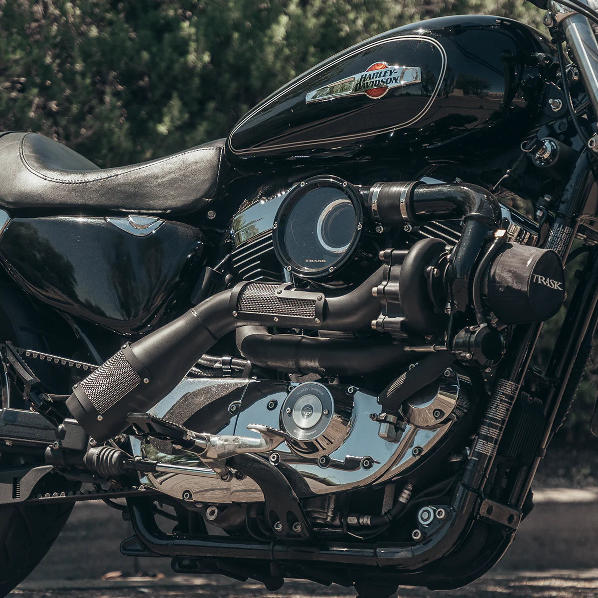 Close up photo of a black on black Trask sportster turbo kit installed on a Harley Davidson sportster