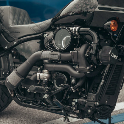 Close up of a black Harley Davidson softail with a black Trask softail assault turbo installed