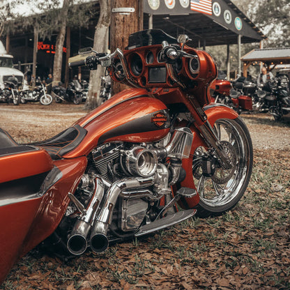 close up shot of a Harley Davidson touring model with a chrome Trask touring typhoon turbo kit installed