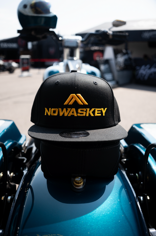 Elevate your look with the stylish black flat brim Nowaskey hat featuring striking Nowaskey yellow embroidery.