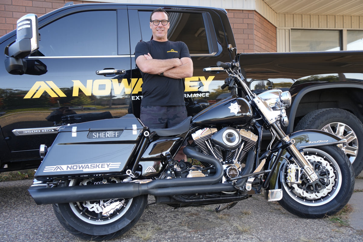 Harley-Davidson Road King with Nowaskey parts in front of the Nowaskey Extreme Performance truck