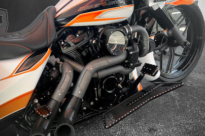 White black and orange Harley Davidson touring model with a black on black Trask touring typhoon turbo kit installed